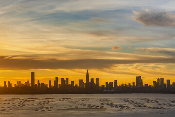 Fototapeta na wymiar Panorama of silhouette of skyline of Shenzhen city, China at sunset. Viewed from Hong Kong border