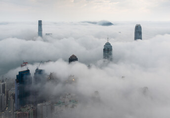Fototapeta na wymiar Panorama of skyline of Hong Kong city in fog
