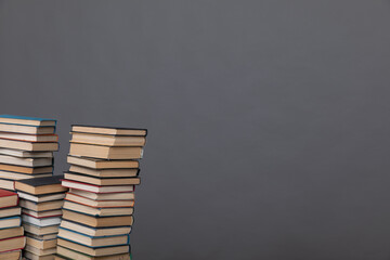 a large number of books on a gray background in the library of science knowledge reading