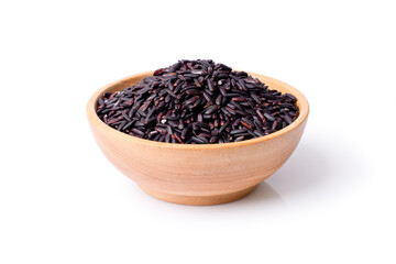 Black rice in wooden bowl isolated on white background. Clipping path.
