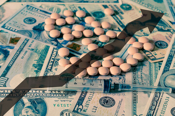 Medicine pills and hypodermic needle with dollars and arrow up. The concept of growth in the...