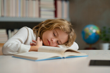 Tired school boy, bored pupil sleeping at school. School and education concept.