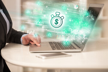 Young man watching stock market on laptop