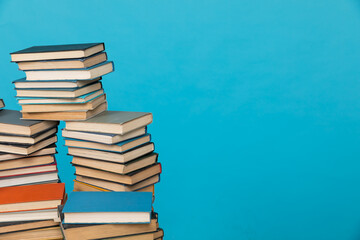 science reading a lot of books on a blue background in the library in the knowledge room