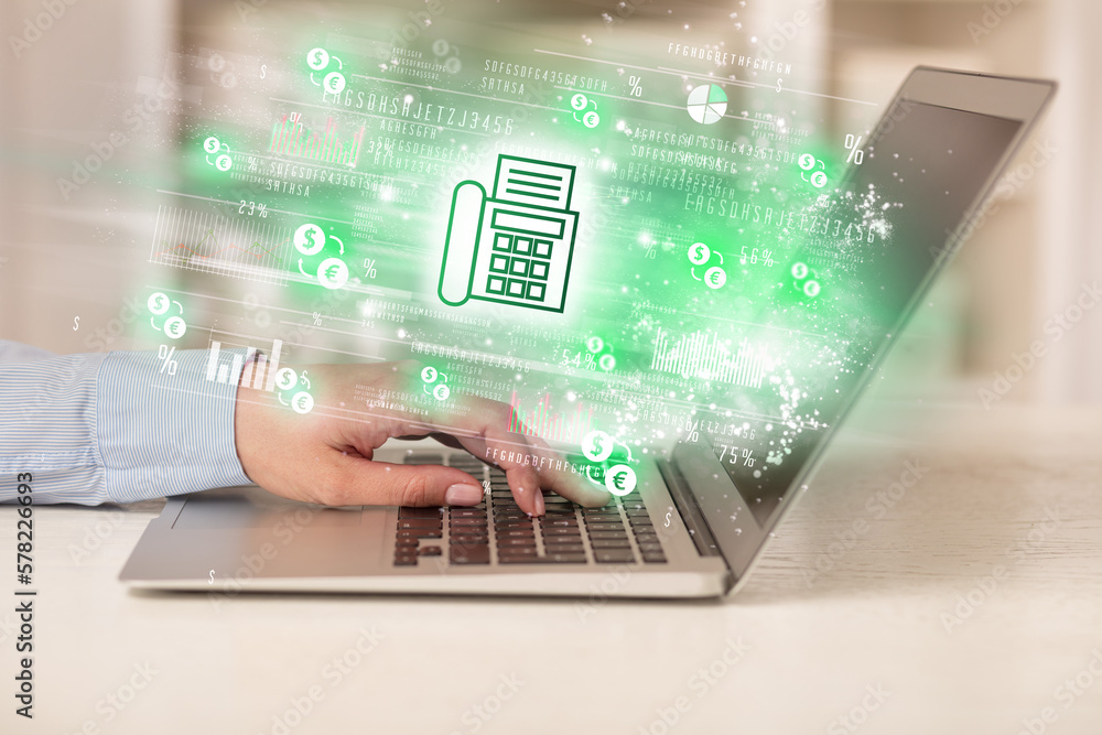 Wall mural Young man watching stock market on laptop