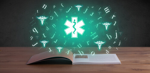 Open medical book with health icons above