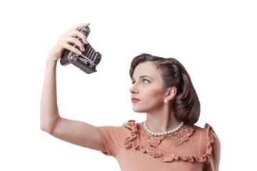 Beautiful woman taking selfies with vintage camera
