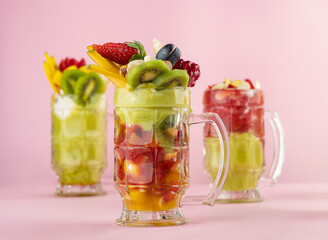 set of Fruit cocktails with fruit topping, Avocado, strawberry, Mango Cocktails with fruits and nut...