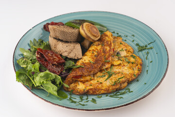 Herb omelet with mushroom, rocket leaves, and  oregano with grilled pepper and dried tomato and  Bread 