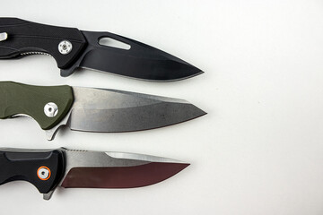 Three tactical combat knives isolated on white