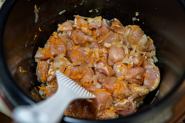 marinated sliced pork pieces cooked and sliced in a barbecue bowl