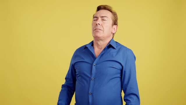 Mature man gesturing that he is forgetting something