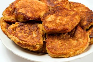 Homemade pancakes on a plate. Homemade cakes cooked in the kitchen.