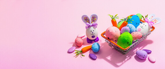 Easter sale concept. Shopping basket with festive symbols - rabbit, eggs, bird, traditional decor