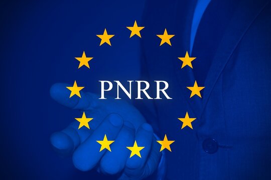European flag with a business man and the text "PNRR" as background