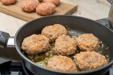 close-up, cooking meatballs in a frying pan