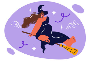 Happy witch flies on broomstick and laughs as she moves in night sky during Halloween