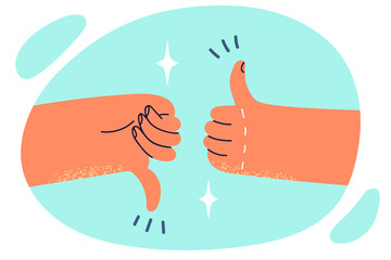 Two hands showing thumbs up or down symbolizes argument on current topic or difficult choice