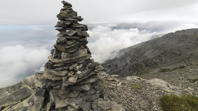Moving Timelapse closeup pile stone cairn Mountain Oympus landscape