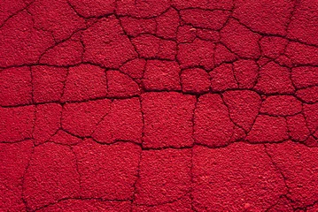 Fototapeten Surreal background of red cracked asphalt. Texture.  © Studio Eli