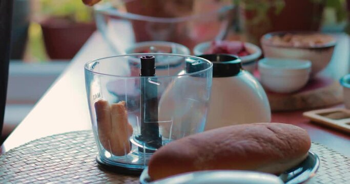 Sandwic breads are cut into several pieces by hand and put into the mixer