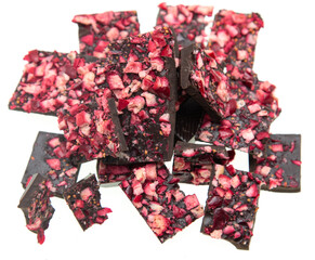 black chocolate with dry berries on a white background
