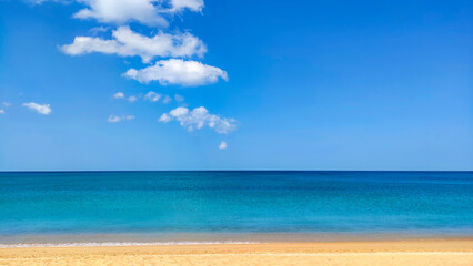 Fototapeta na wymiar beach, sea, white clouds and blue sky