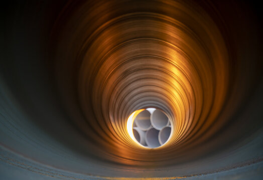 Interior of Metal pipeline photographed with depth of field effect