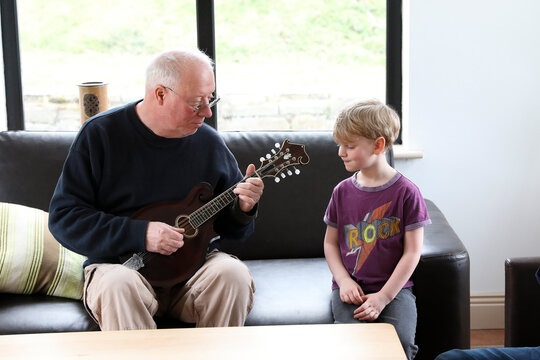 Grandfather Plays Mandolin for Kindergarten Aged Grandson