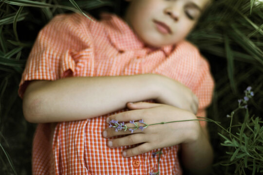 Boy lying in the grass
