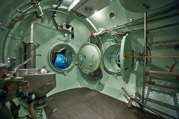 Inside the divers decompression chamber, shower room.