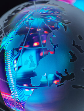Circuit board reflecting in shiny globe