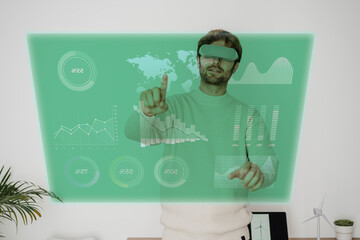 Businessman wearing virtual reality simulators examining graph at office