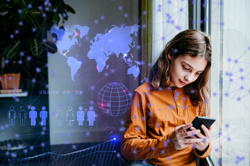 Girl looking at graphs and data through smart phone leaning on wall