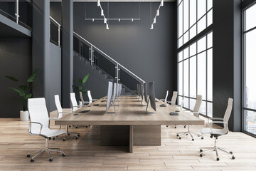 Modern interior design of spacious office hall with wooden meeting table surrounded by light stylish wheel chairs on parquet with dark wall background and city view from panoramic window. 3D rendering
