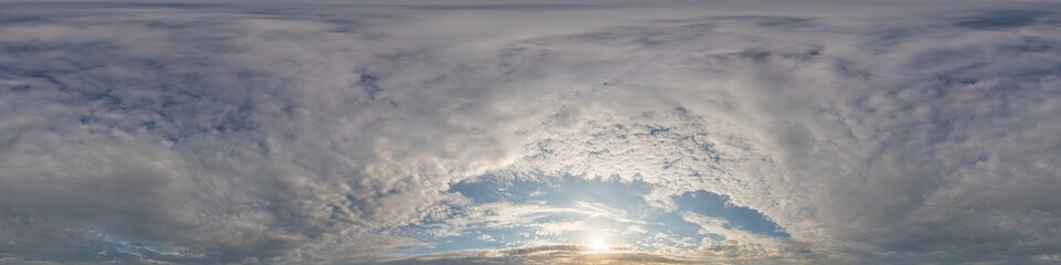Dark blue sunset sky panorama with golden Cumulus clouds. Seamless hdr 360 panorama in spherical...
