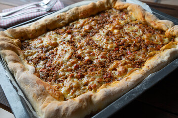 Minced meat pizza with ground beef, vegetables and cheese