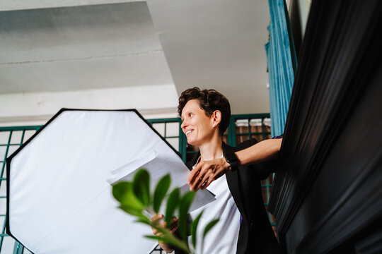 Film director holding script on set