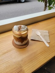 coffee on the table
teaspoon
Latte
cream on coffee