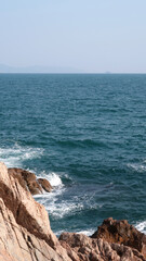 waves crashing on rocks