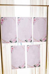 Frames for the list of the wedding guests. Wedding seating plan displayed on cards with flowers. Place for an inscription.