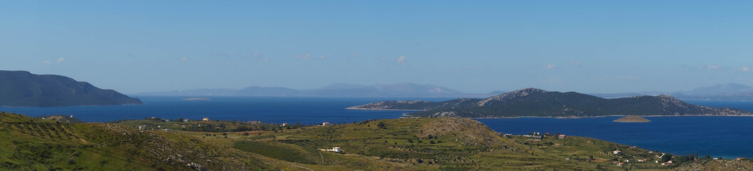 Fototapeta na wymiar Panoramic view of the sea bay and the island in it. Euboea, Greece.