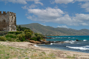 Fototapeta premium View of the bay and the ancient Venetian fortress in the town of Karystos on the island of Euboea, Greece