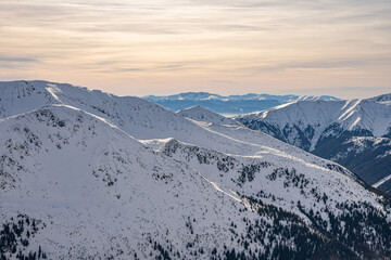 View of the Tatra Mountains in winter from the peak of Kasprowy Wierch. Sunny weather during a hike in the mountains.