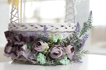 Fototapeta na wymiar Easter basket. A purple Easter basket decorated with decorations. Close up