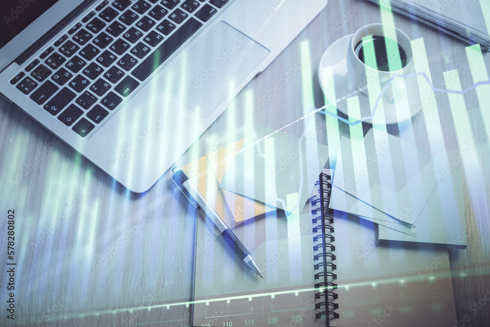 Poster stock market graph and top view computer on the table background. double exposure. concept of financ