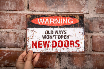 Old Ways Won't Open New Doors. Warning sign with text - obrazy, fototapety, plakaty
