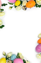 Easter decoration. Easter frame of colored easter eggs and white roses flowers on white background...