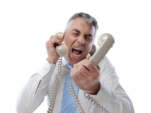 Stressed Businessman Answering Many Phone Calls