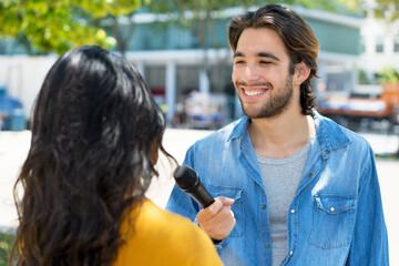 Interview of hispanic male journalist for radio station or television